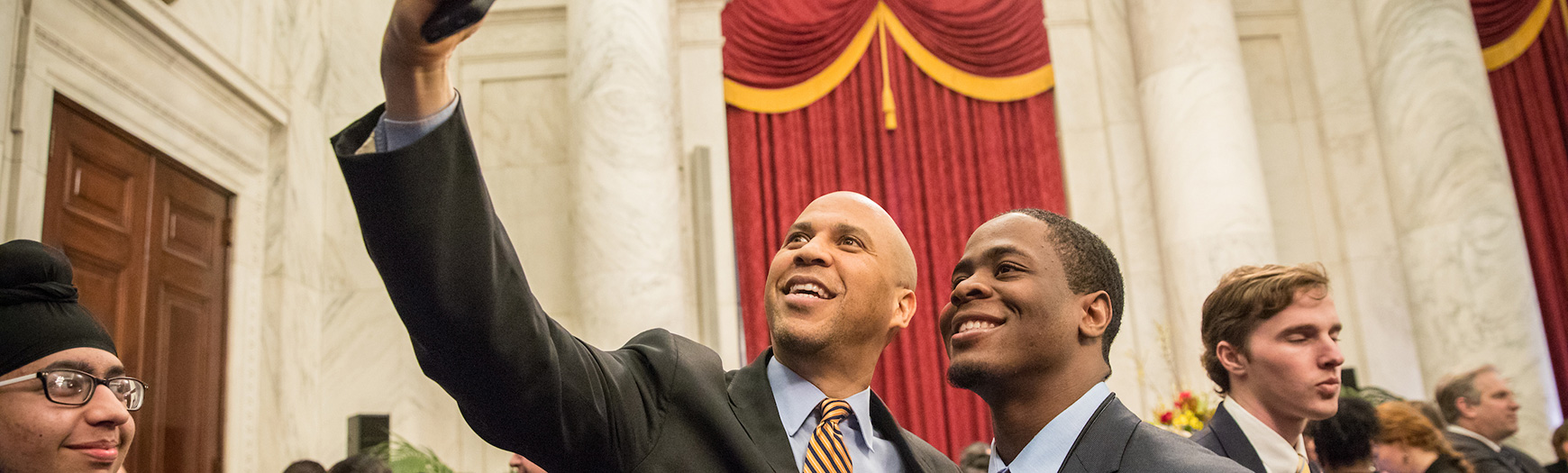 Senator Cory Booker (D-NJ) takes a selfie with a New Jersey delegate at the USSYP Senate reception, Washington, DC